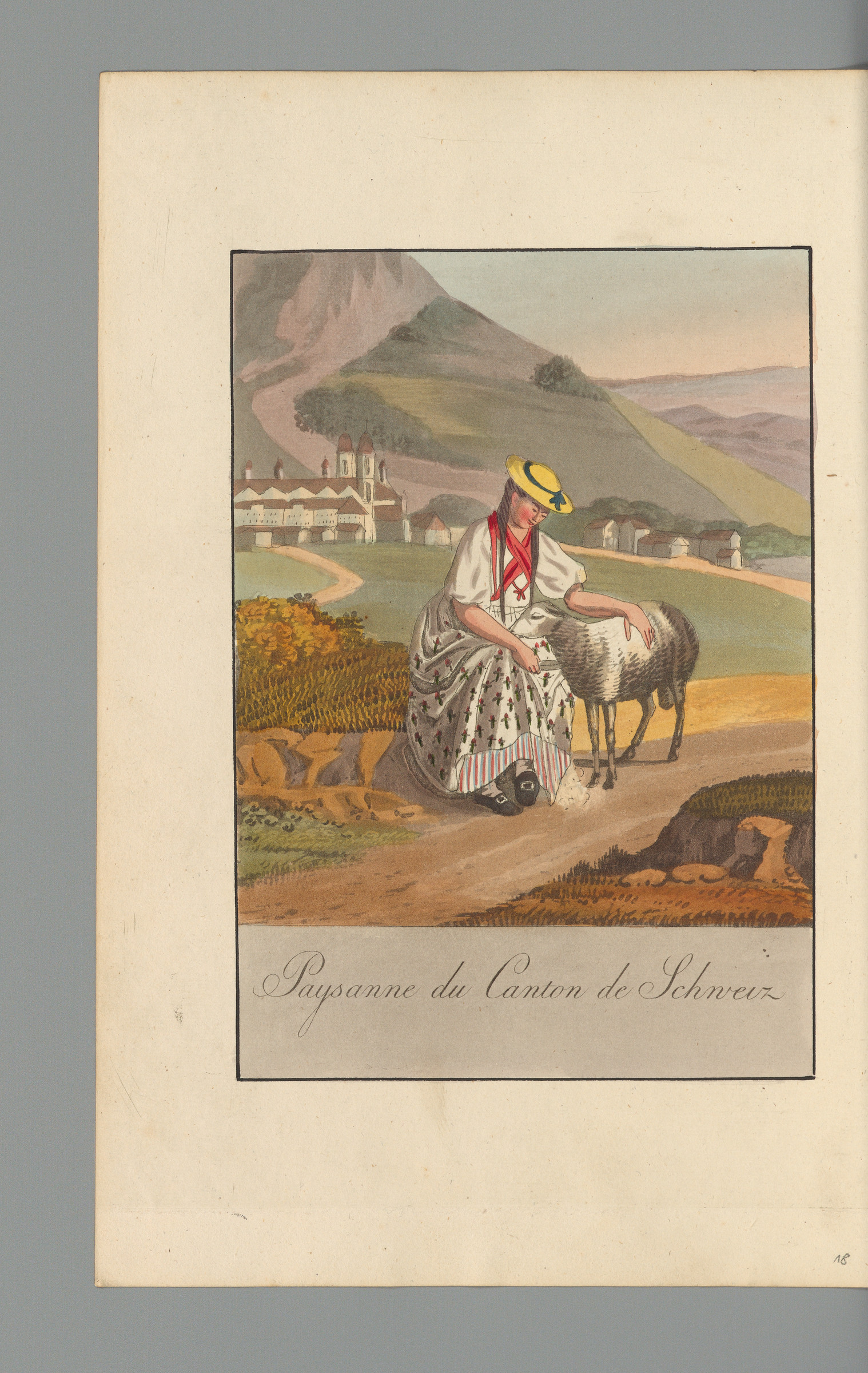 Femme assise portant le costume du canton de Schwytz, caressant un mouton, derrière elle un paysage avec le monastère d’Einsiedeln